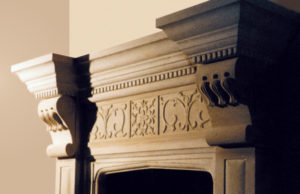 close up detail of fireplace design bespoke carved natural stone